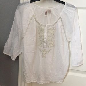 White top with embellished detail
